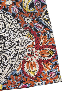 Paisley print midi dress with tie neck, featuring a vibrant floral pattern in red, orange, yellow, and blue.