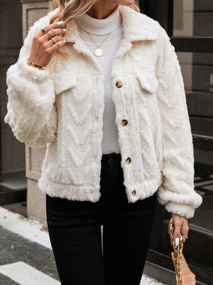 Ivory textured shearling-effect utility jacket with button closures and chest pockets.