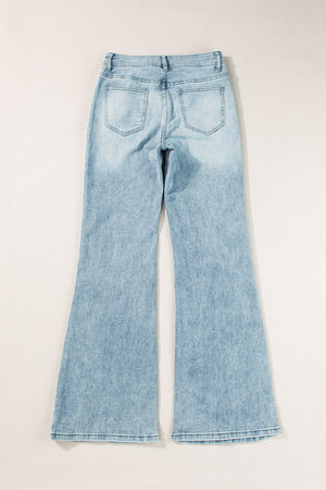 High-waisted palazzo flare denim jeans in medium wash, showing back pockets and flared legs.