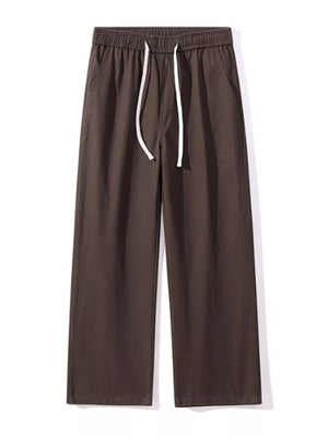Relaxed fit drawstring pants in coffee brown with white drawstring and elastic waist.