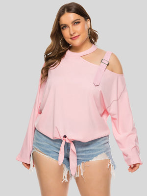Blush pink cold shoulder blouse with cutout neckline, shoulder buckle detail, and tie front.