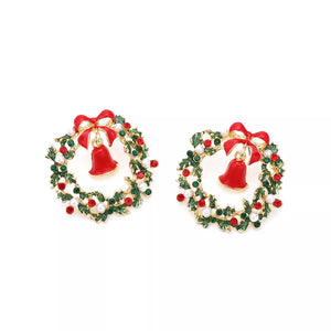 Festive wreath dangle earrings with red bells, bows, and red and pearl accents.