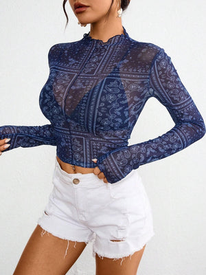 Dark blue bandana print mesh mock neck long sleeve top with lettuce trim.