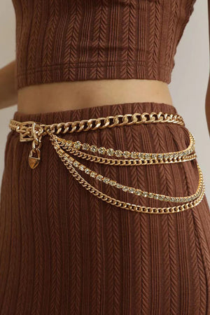 Gold layered chain belt with rhinestone accents and a heart charm.