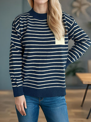 Dark blue and cream striped knit sweater with asymmetrical pocket detail.