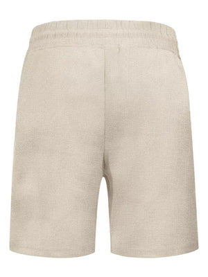Khaki textured jogger shorts with elastic waistband and drawstring detail.