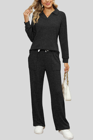 Black ribbed knit lounge set with collar, long sleeves, drawstring waist pants with pockets.