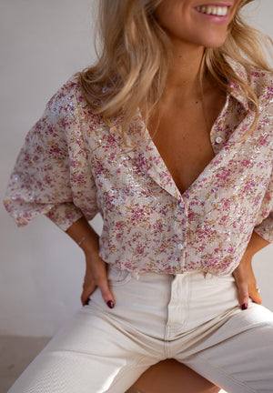 Sequin floral print relaxed fit blouse in dusty pink with button-down front and puffed sleeves.