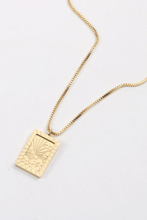 18K gold-plated celestial pendant necklace with sunburst detail on a box chain.