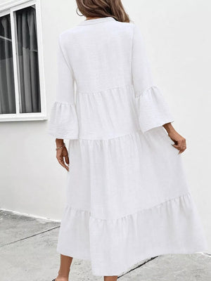 White tiered ruffle hem midi dress with bell sleeves and V-neck.