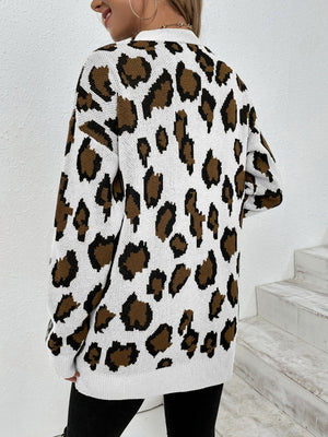 White leopard print knit open-front cardigan with long sleeves.