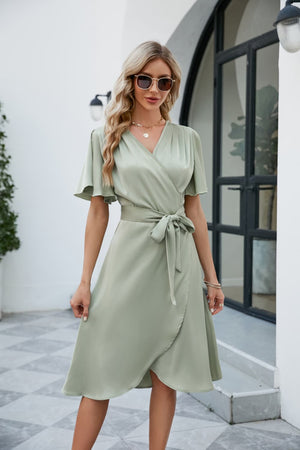 Light green silk wrap midi dress with butterfly sleeves and adjustable tie waist
