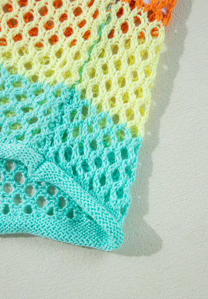 Rainbow crochet openwork sweater in aqua, yellow, and orange acrylic with a knit hem.