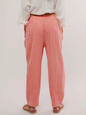 Gingham check wide-leg pants in pink and yellow with pockets.