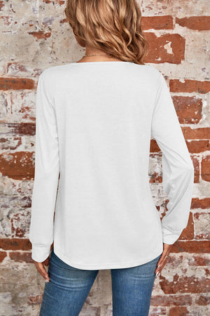 White long sleeve top with square neckline and subtle pleats, casual chic style