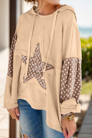 Tan hoodie with star patchwork and floral sleeves, featuring raw edges and drawstring hood.
