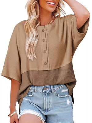Khaki waffle-knit t-shirt with button detail and textured lower panel.