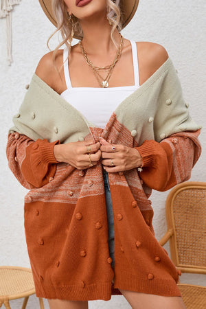 Textured colorblock bobble cardigan in pink and caramel acrylic with a relaxed fit.