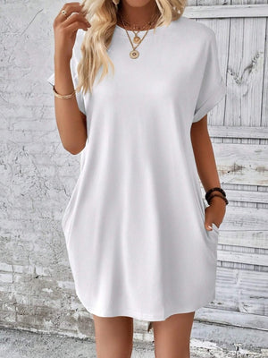 White relaxed tee dress with cuffed sleeves and pockets