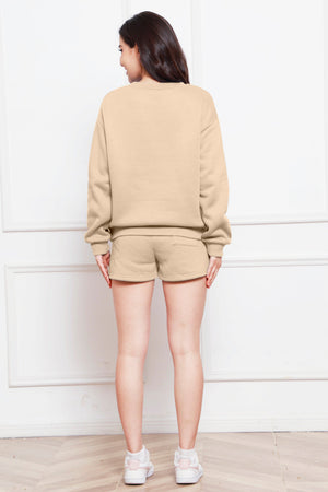 Beige crewneck loungewear set with pocket shorts.