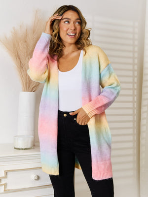 Rainbow gradient longline knit cardigan with pastel colors, open front, and long sleeves.