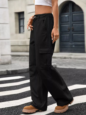Black high-waisted cargo jeans with multiple pockets and a relaxed fit.