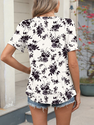 Women's white floral print short sleeve blouse with a casual fit.