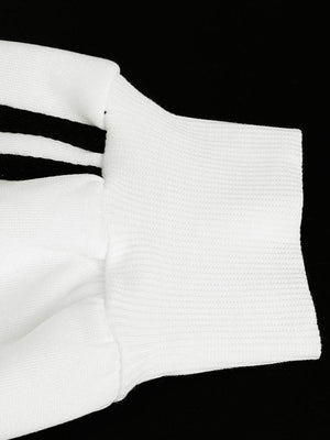 White zip-up hoodie with black stripes on sleeve and textured cuff