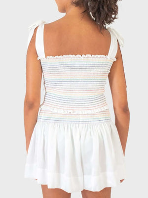 White outfit set with rainbow smocked bodice and tie straps, and a ruffled hem skirt.