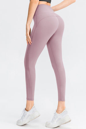 Lilac performance leggings with subtle side mesh panels and a high waist.