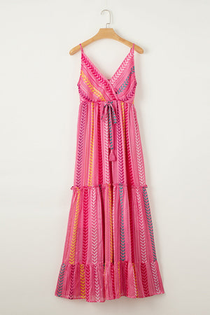 Pink chevron stripe tiered maxi dress with V-neck and tie waist.