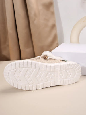 Southwestern print faux fur lined loafers in taupe with a textured sole.