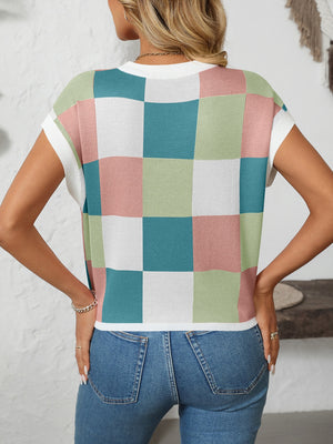 Checkerboard knit cap sleeve top in pastel pink, blue, green, and white.