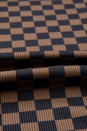 Checkerboard knit t-shirt in dark brown and navy with a ribbed texture.
