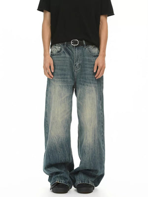 Men's baggy fit blue denim jeans with a faded wash and relaxed cut.