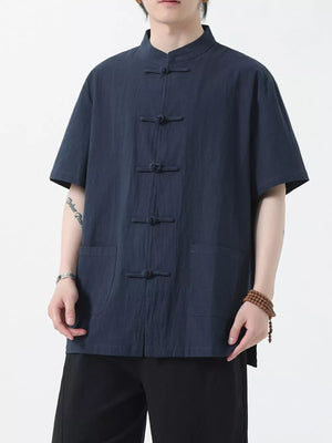 Navy blue cotton short-sleeve shirt with mandarin collar and frog button closure.