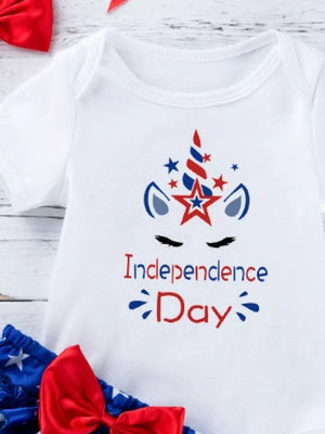 White baby onesie with patriotic unicorn and Independence Day text.
