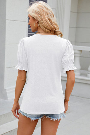 White tee with puffed sleeves and ruffled cuffs, crew neck, casual fit