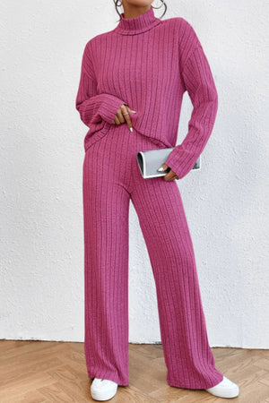 Hot Pink ribbed knit turtleneck lounge set with wide leg pants and long sleeves.