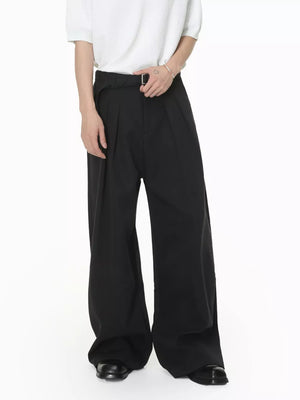 Black wide-leg pleated sweatpants with a belted waist and contemporary fit.