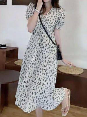 White botanical print midi dress with puff sleeves and a-line cut