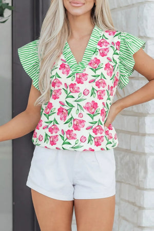 Tulip print ruffled V-neck blouse with green striped trim and flutter sleeves.