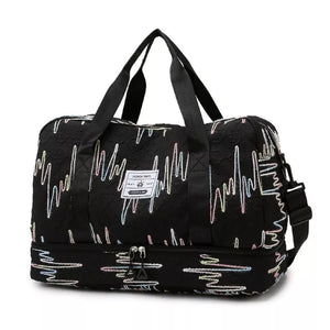 Textured black Oxford duffel bag with colorful wave pattern and dual zip bottom compartment.