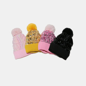 Metallic padded beanies with faux fur pom in pink, gold, and black