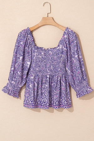 Paisley smocked bodice blouse in lavender with square neckline and ruffled cuffs.