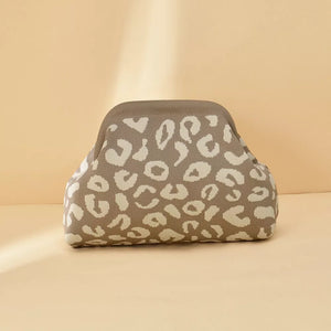 Knit clutch bag with a taupe and cream leopard print pattern.