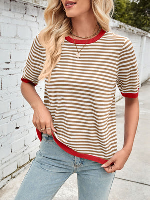 Striped knit tee with red trim and crew neck, styled with light wash jeans.