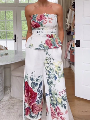 Chic floral ruched strapless top and wide-leg pants set with a white polyester base.