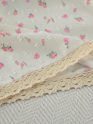 Cami and shorts set with delicate floral print and lace trim.