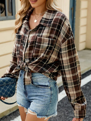 Brown plaid collared long sleeve shirt with buttoned pockets, tied at waist